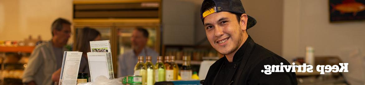 Pima culinary student working a deli